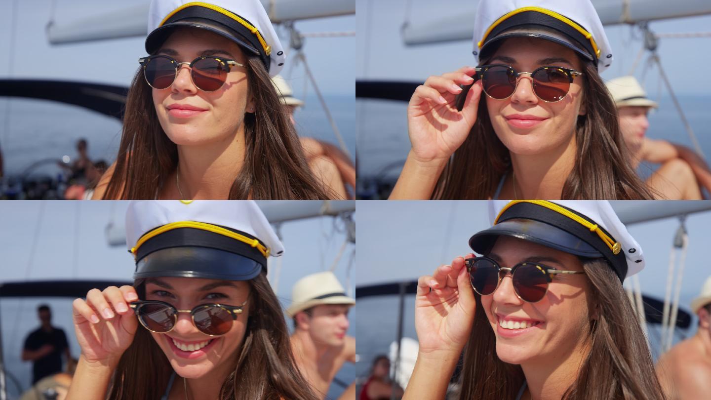 一位年轻女子在船上放下太阳镜微笑的肖像