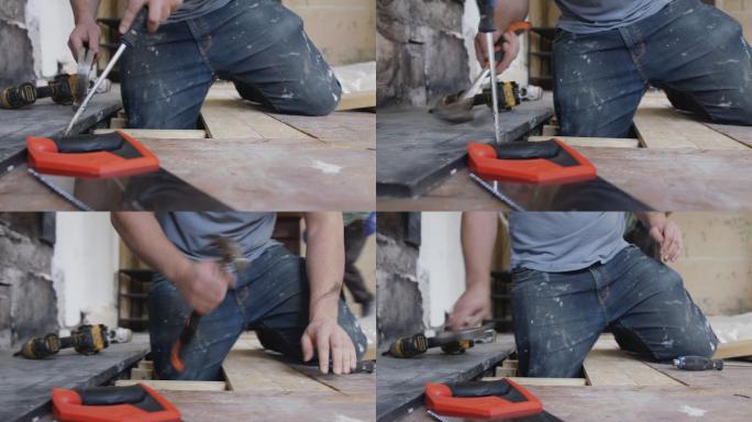男建筑工人安装地板