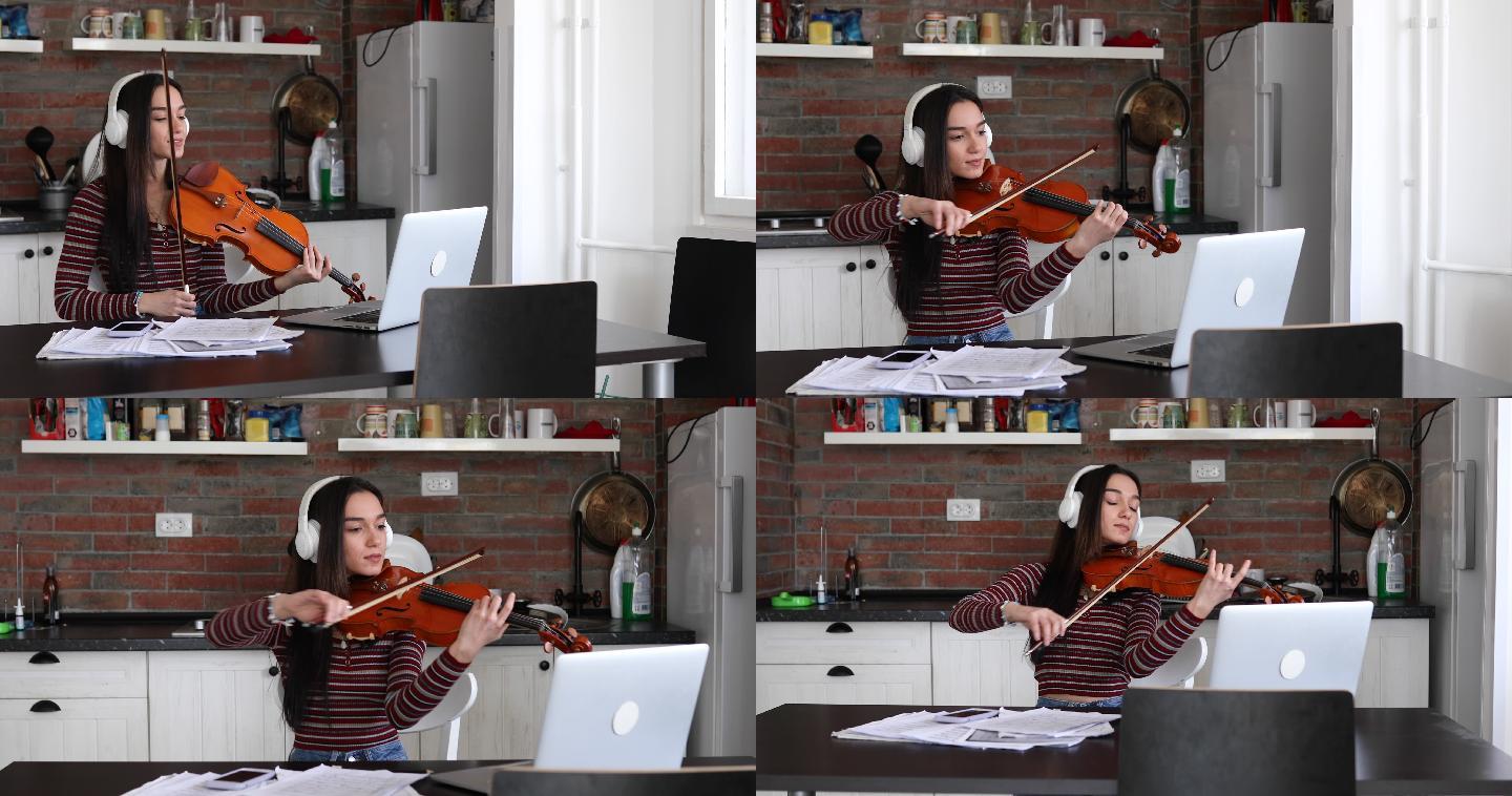 音乐学校的天才学生在家里的在线课堂上拉小提琴。