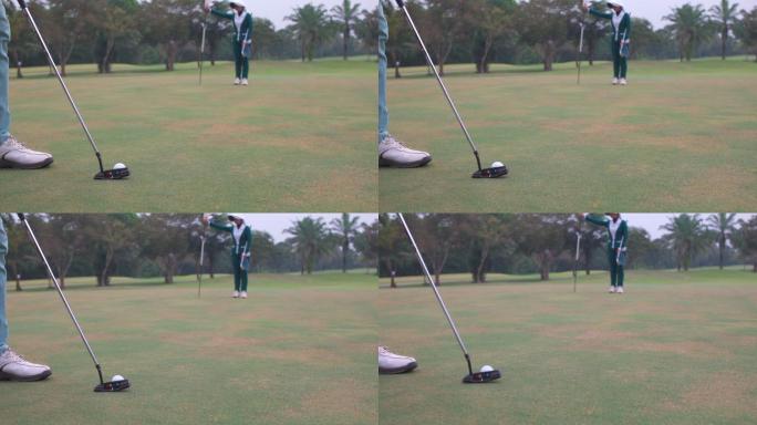 4K亚洲男子高尔夫球手在球道上把球打过一个洞