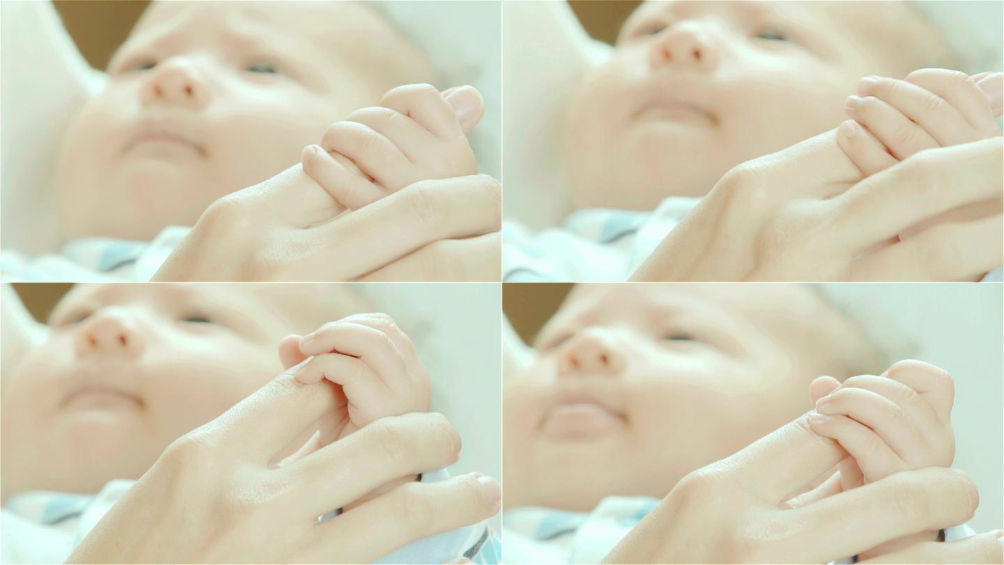 SLO MO&新生儿抱着母亲手指的特写镜头