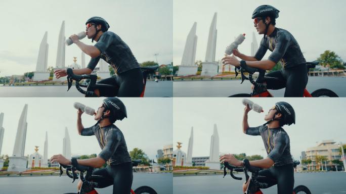 英俊的骑手在城里骑自行车时休息。