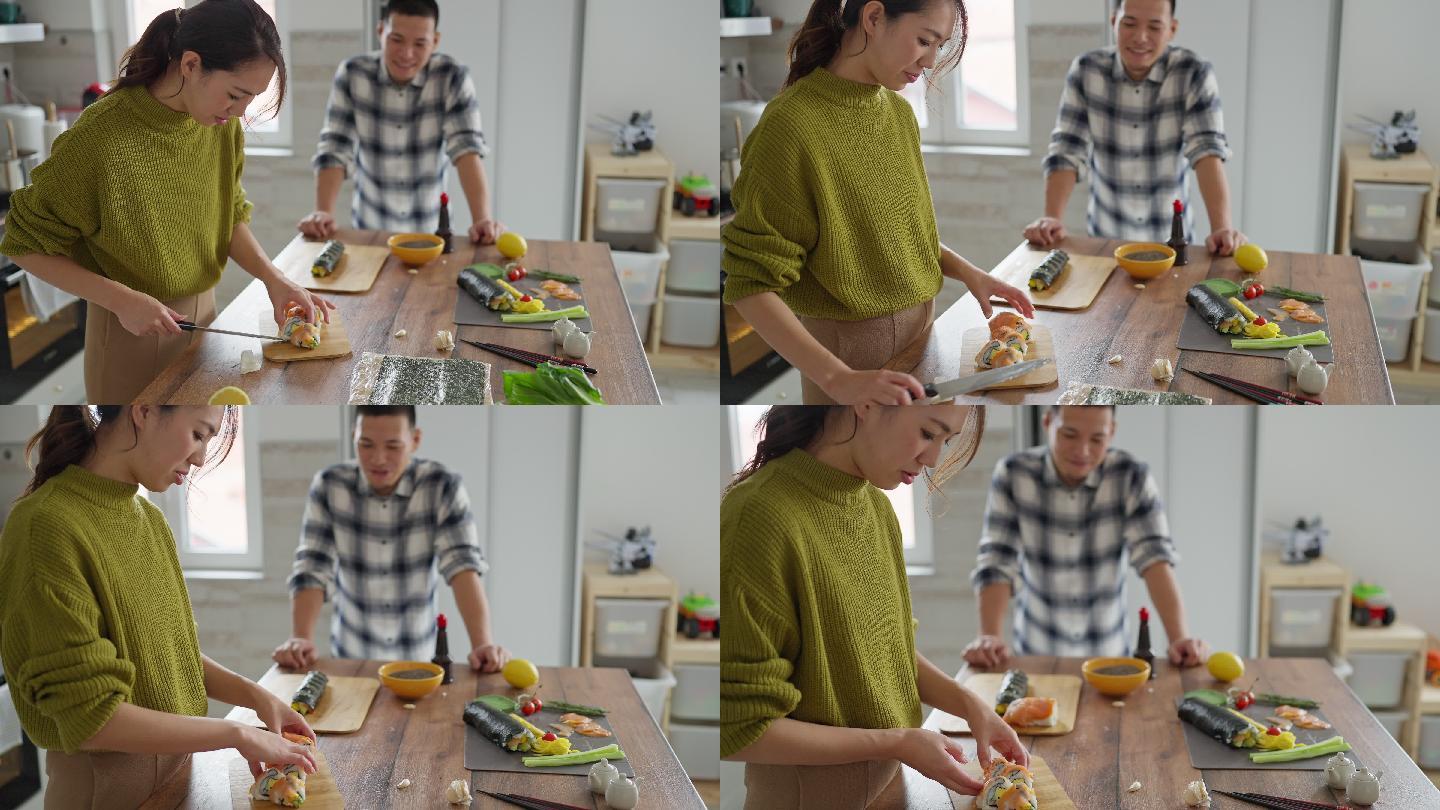 熟练的日本女性切割鲑鱼寿司卷