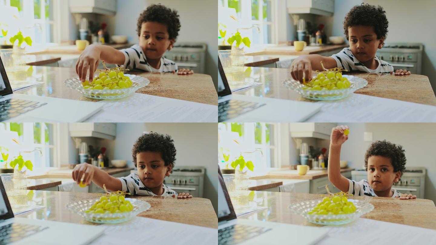 一个小男孩吃葡萄的4k视频片段