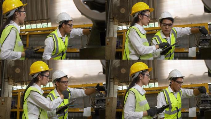 工程师们正在为工业工人使用机器。戴着安全帽和反光背心的亚洲男女工人在工厂工作。男工程师教学徒使用机器