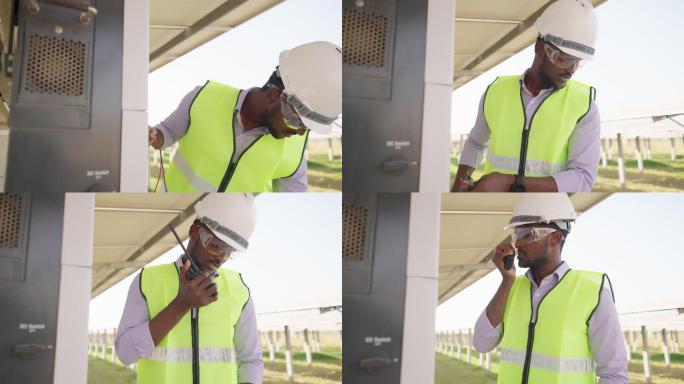 在太阳能农场，非洲年轻工程师穿着防护服，戴着安全眼镜和头盔，通过无线电与团队进行沟通