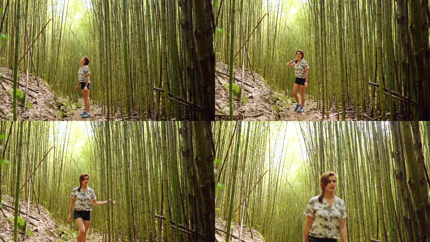 年轻女子在竹林中徒步旅行时四处张望