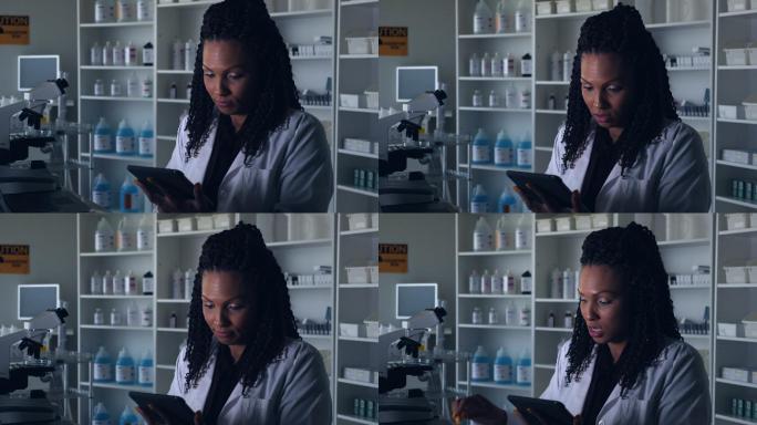 非裔美国女科学家在实验室阅读科学测试结果