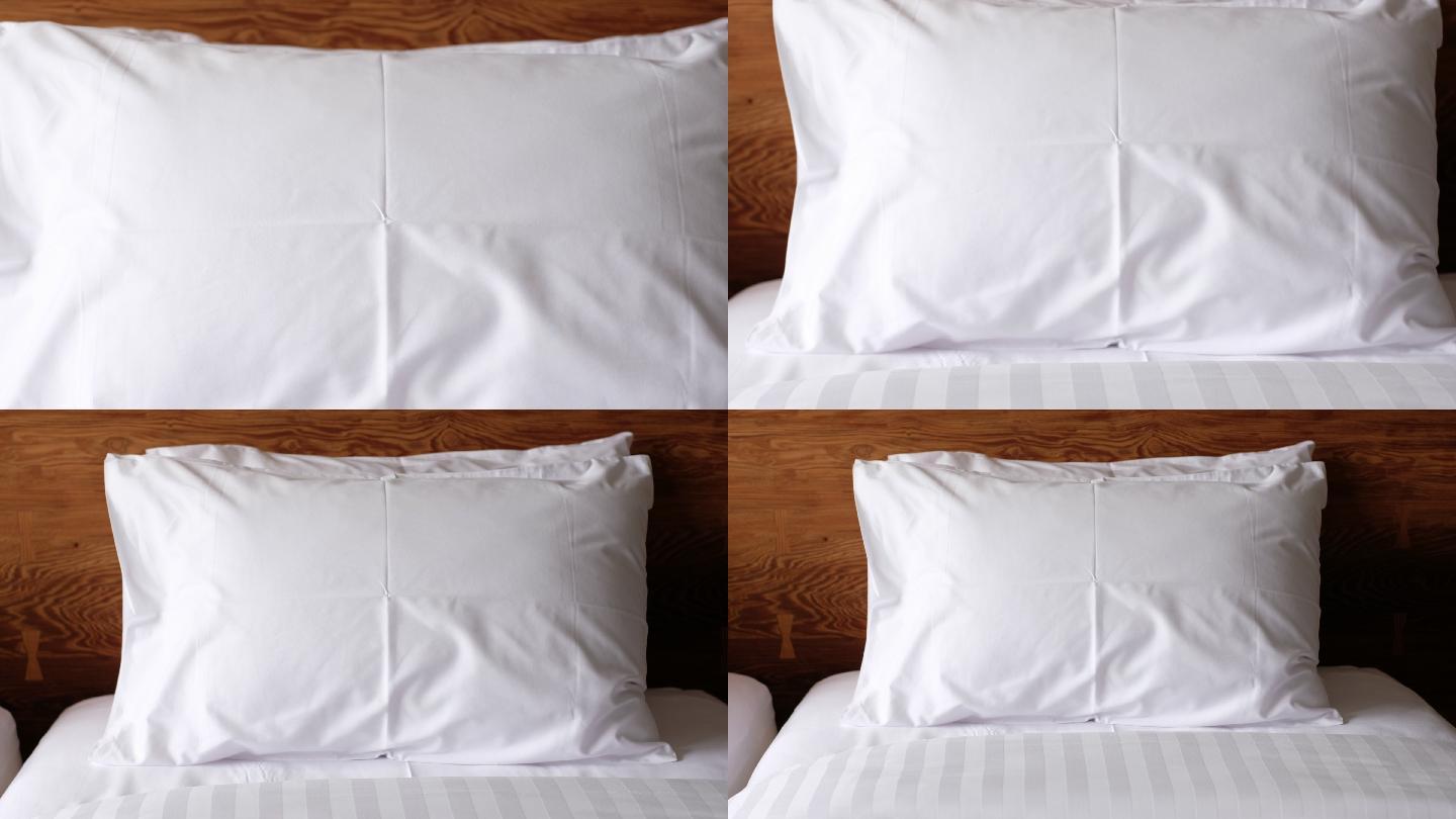 缩小卧室床上的白色枕头