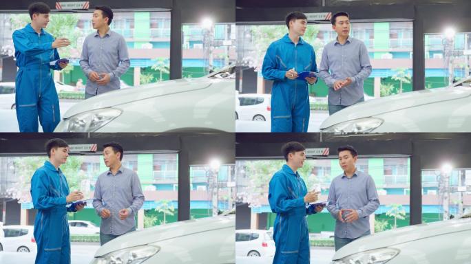 亚洲汽车技师在车库向客户解释汽车状况。车辆维修经理男性在机械车间工作，负责车辆零件的维修和保养