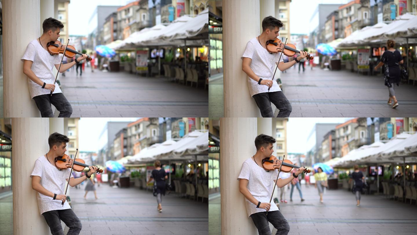 街头艺人拉小提琴小提琴手拉小提琴街边拉小