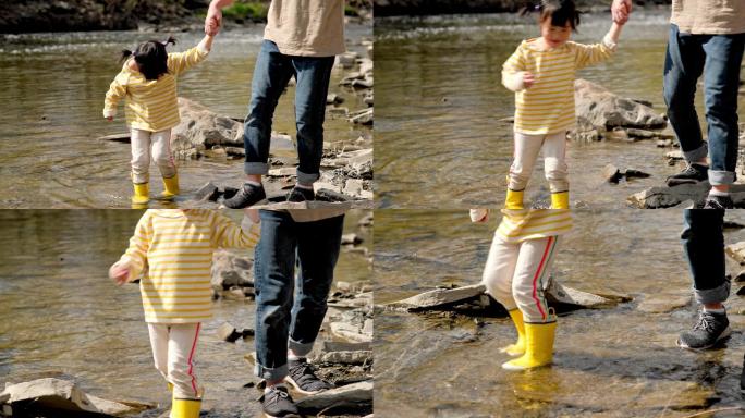 把自己带到水里流淌的小溪黄色雨鞋亲子