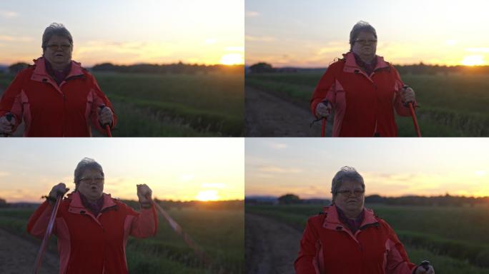 中景：一位活跃的老年女性在乡村行走后感到满意的照片