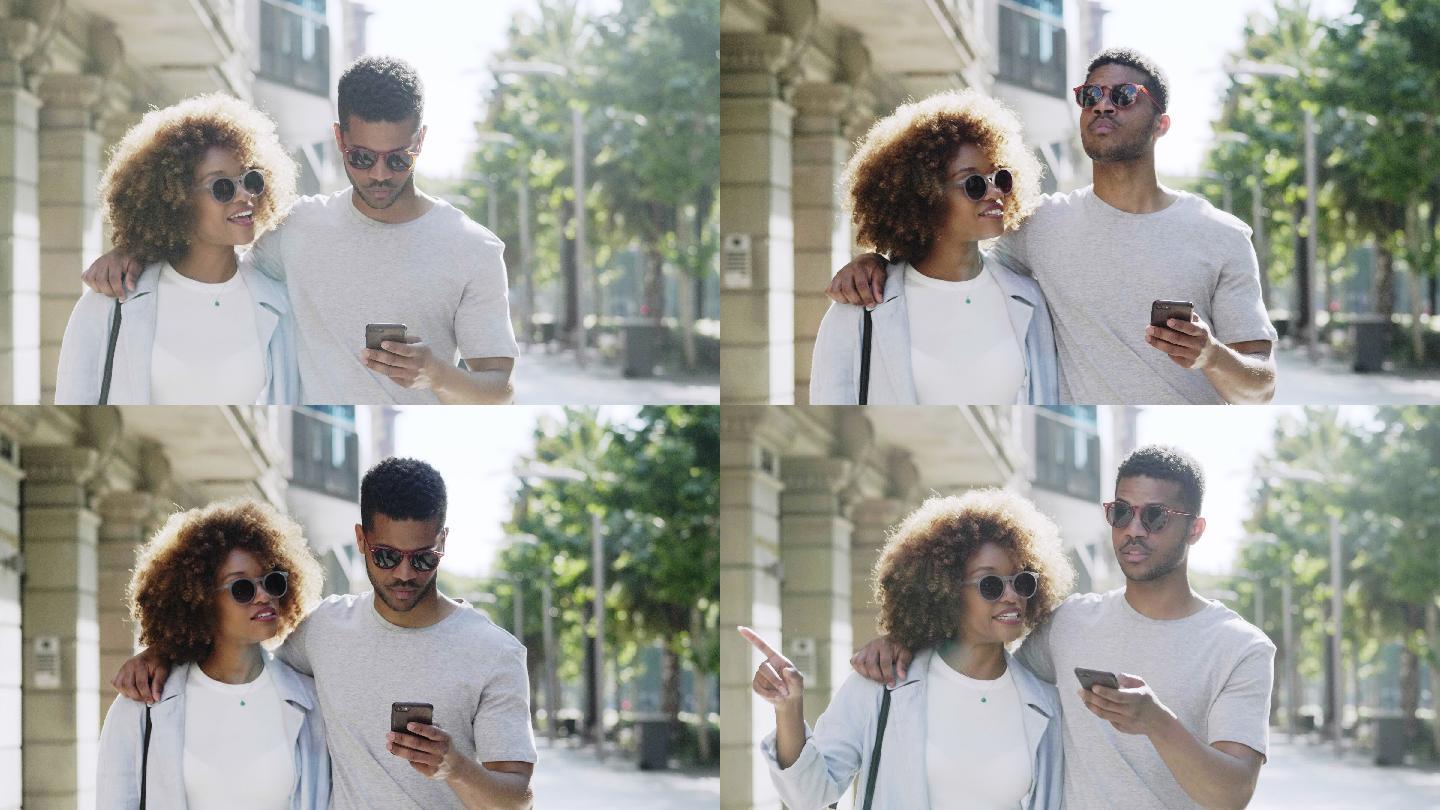 年轻夫妇在智能手机上寻找方向
