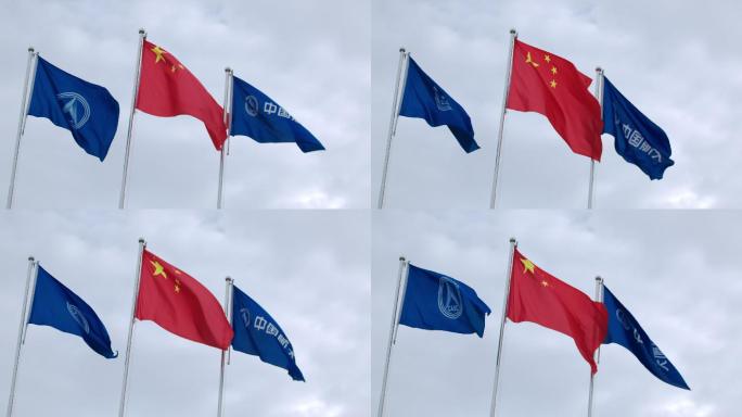 飘扬的国旗和中国航天旗帜