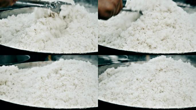 在锅上煮米饭大锅饭食堂大米饭