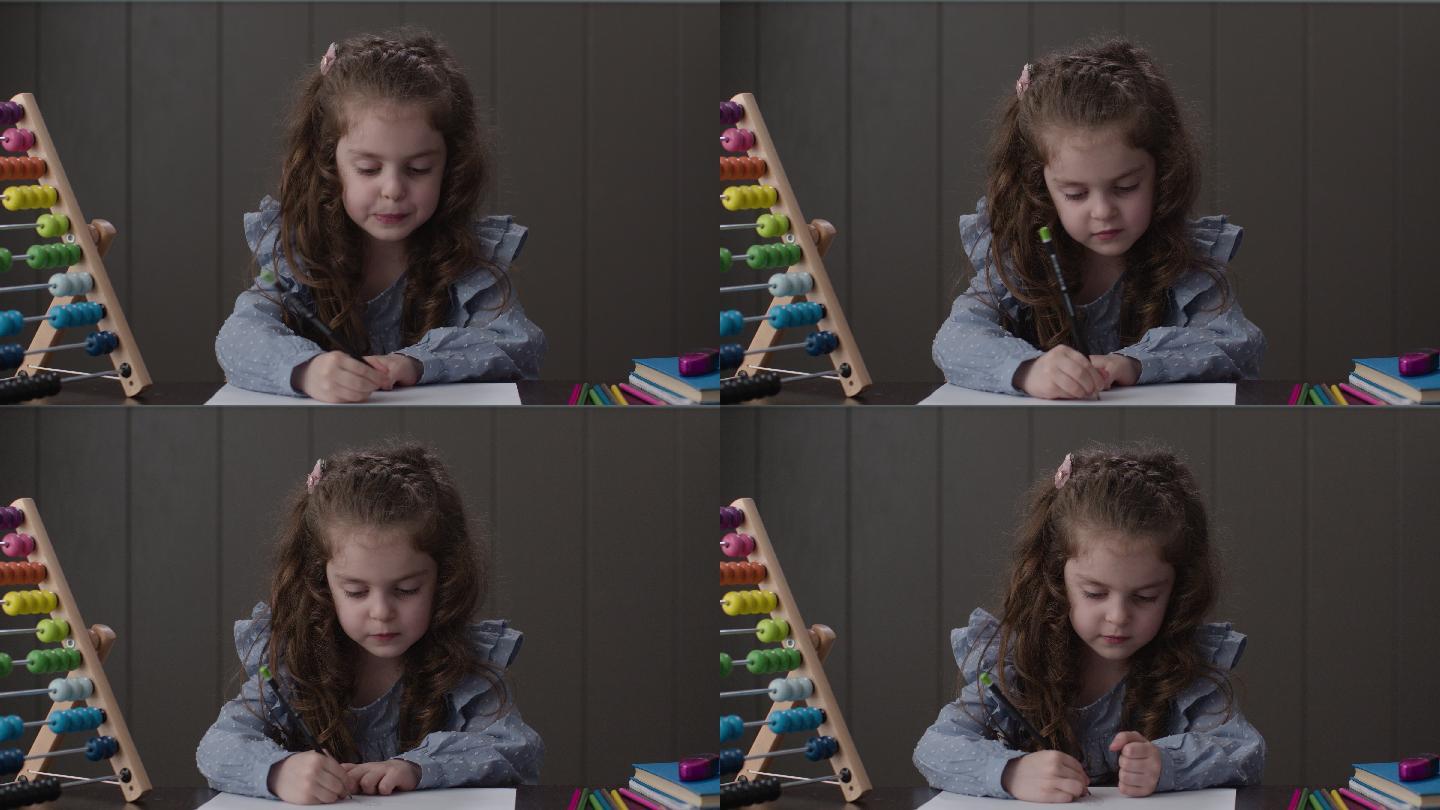 幼儿绘画小女孩拿铅笔画画绘画的小女孩童年