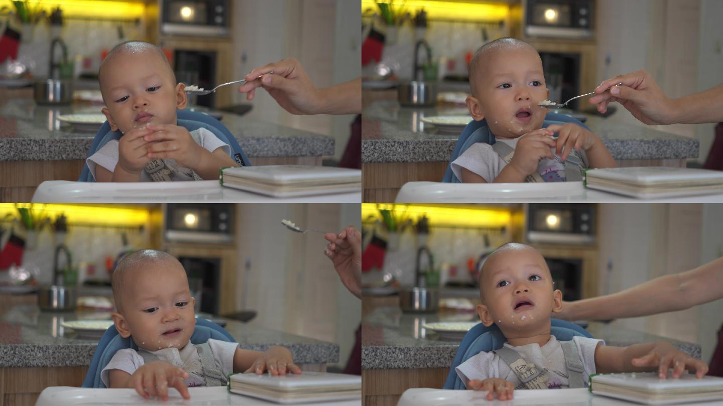 男婴试图说服妈妈给他吃点别的东西
