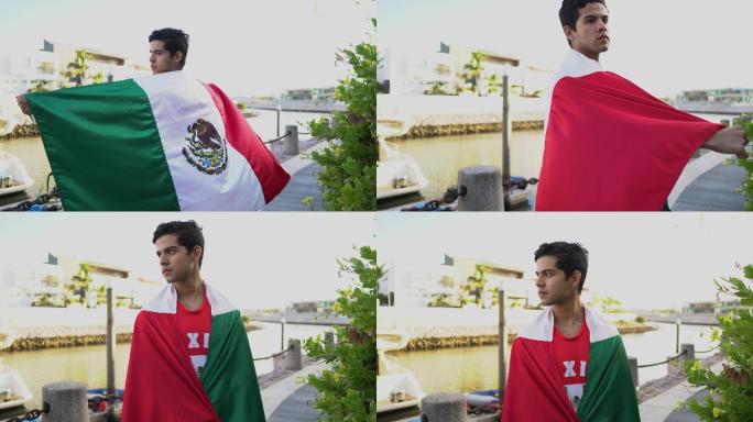 户外挂着墨西哥国旗的十几岁拉丁男孩