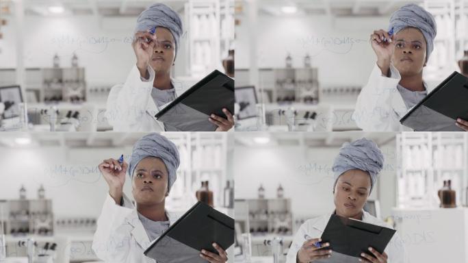 一位年轻科学家在实验室的玻璃屏幕上解方程的4k视频片段