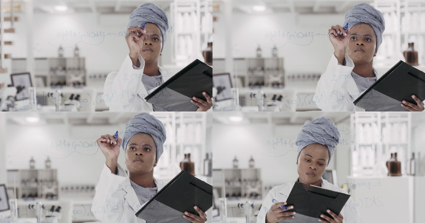 一位年轻科学家在实验室的玻璃屏幕上解方程的4k视频片段