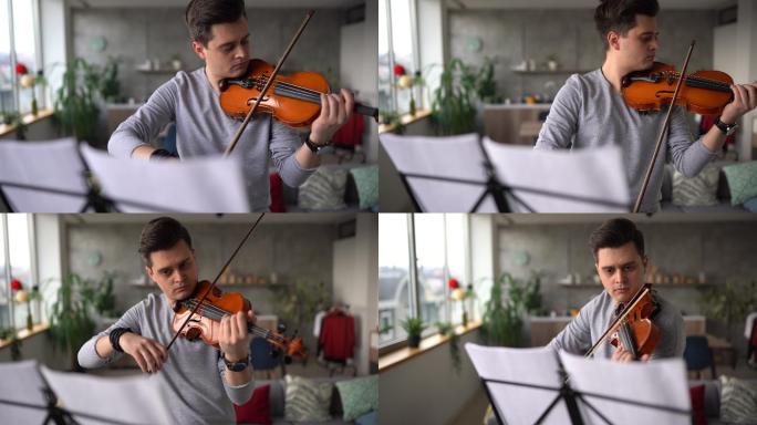 小提琴家在客厅排练乐曲