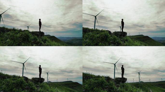 男人登顶山峰，成功人士站在山顶眺望远方