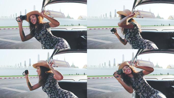 年轻的拉丁女性游客在泰国曼谷的著名景点Tuktuk乘坐出租车度假时，面带微笑，心情愉快。