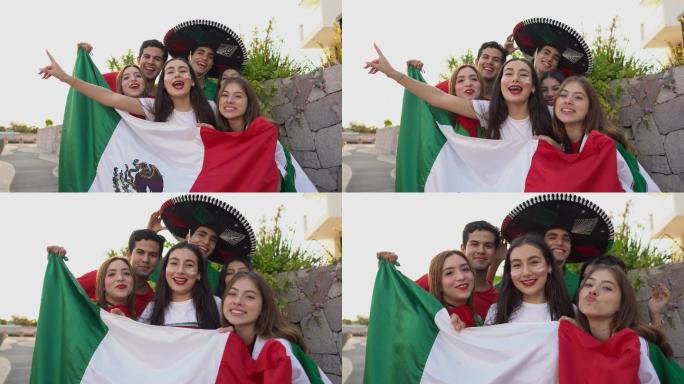 青少年拉丁朋友在户外庆祝墨西哥足球队获胜的肖像