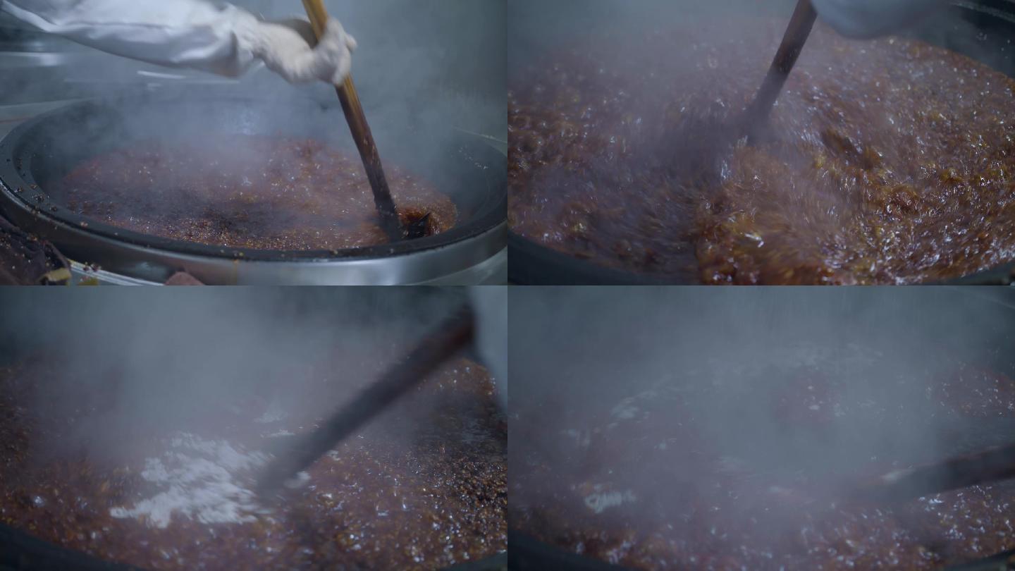 工人在大锅里炒制辣椒酱 辣椒酱制作