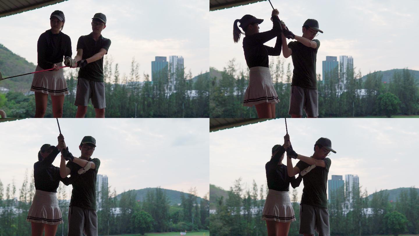 活跃的女高尔夫球手在高尔夫球场教男孩如何打高尔夫球