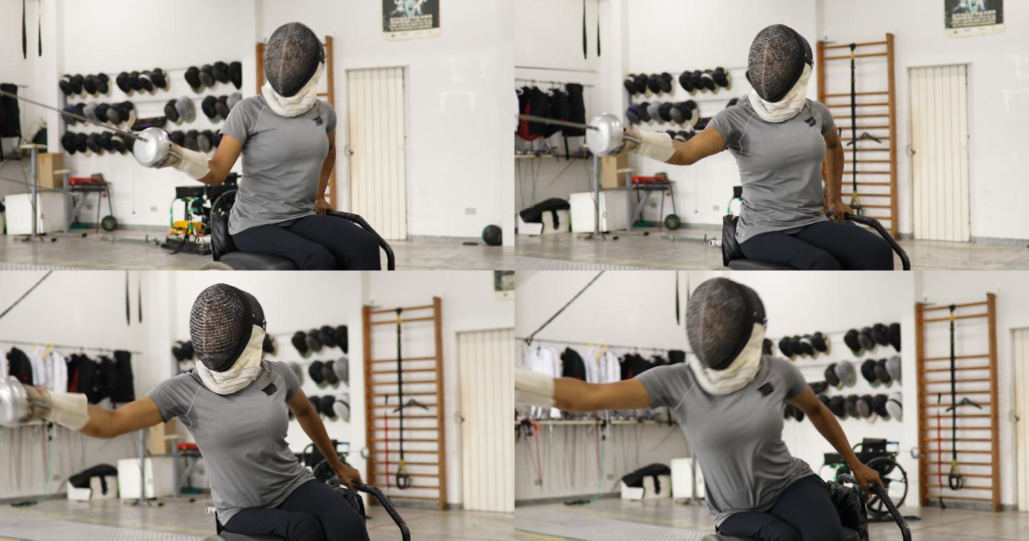 女子轮椅击剑运动员与教练一起训练