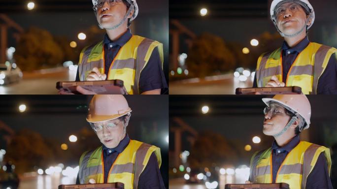 亚洲男性土木工程师或建筑师在互通式高速公路施工现场戴安全帽、穿安全背心。值夜班时，工头在数字平板上行