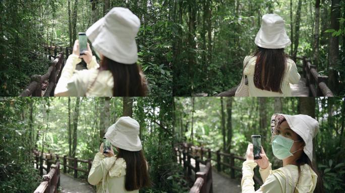 冒险新常态概念旅游度假亚洲年轻人享受户外冒险拍照社交媒体旅行者使用手机在泰国krabi emeral
