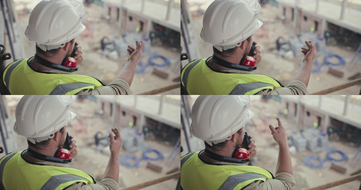 建筑承包商在施工现场工作时使用双向无线电的4k视频片段