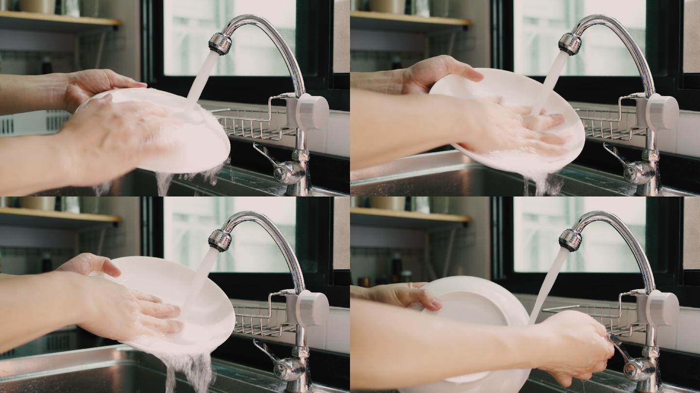 不认识的人用手洗盘子。