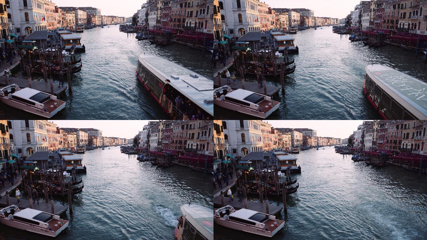在威尼斯度假时发现里亚尔托大桥和大运河，POV。日落