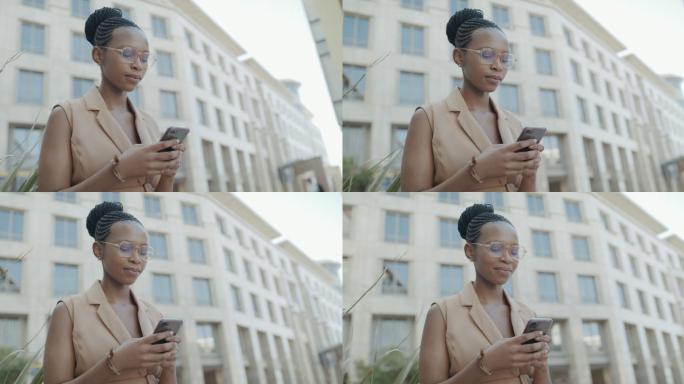 城市中一名年轻女商人使用智能手机的4k视频片段