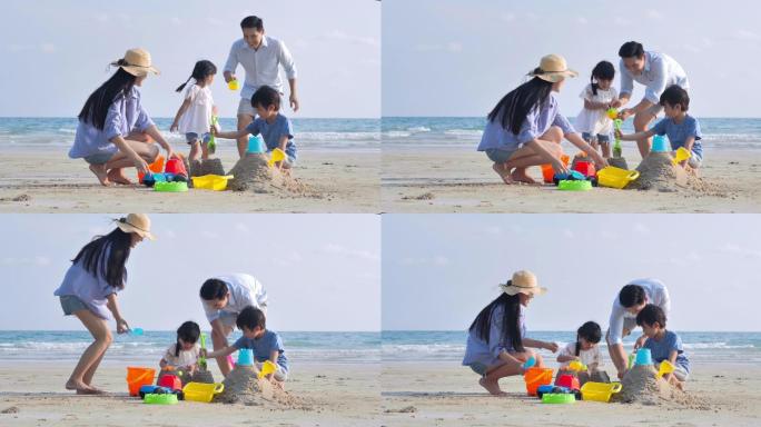 幸福的一家，父亲是亚洲人，母亲是4-8岁的男孩和女孩，他们在夏天的海滩上玩沙滩玩具。积极的家长和人们