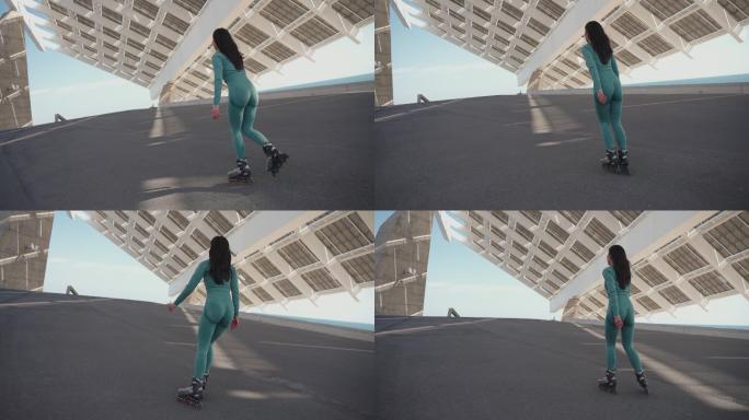 无法辨认的中国年轻女子，在大型太阳能电池板结构下在线滑冰