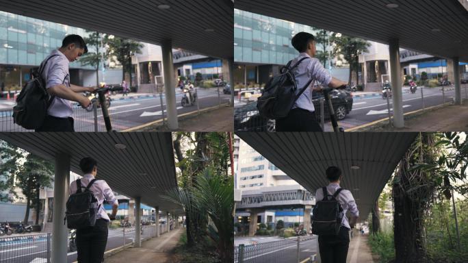 亚裔华裔商务人士骑电动推式踏板车进城工作