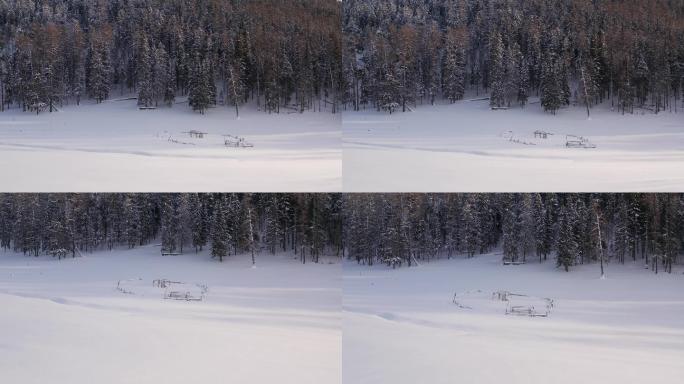 喀纳斯冰雪中的小景房屋框架孤寂感