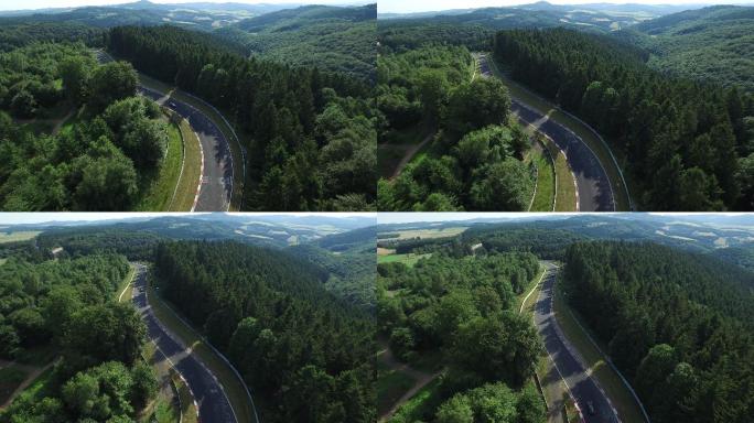 德国公路汽车航拍森林中间马路上的车