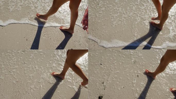 海边的年轻女子双脚踩在沙滩上比基尼修长双
