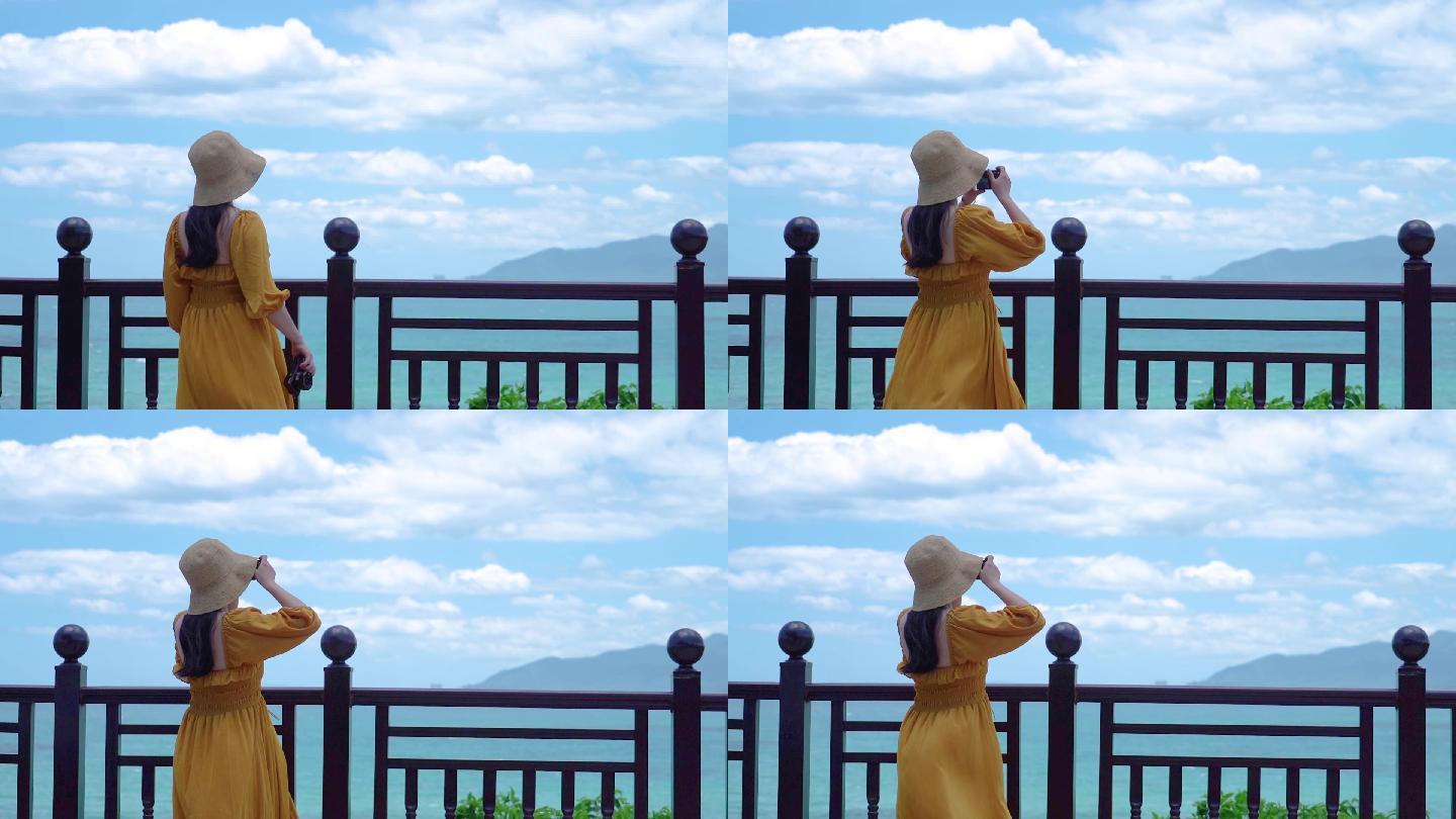 海南万宁石梅湾一个美女在海边拍照