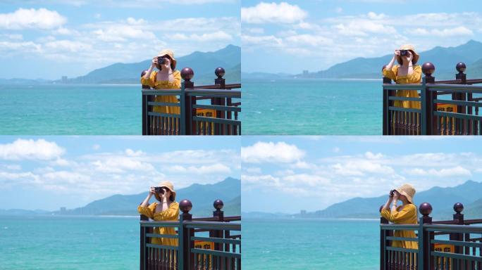 海南万宁石梅湾一个美女在海边拍照