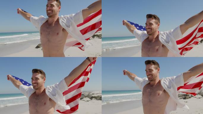 海边的年轻人海边男人手拿国旗