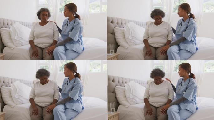 一名混血妇女在家接受护士的探访。隔离期间的社交距离和自我隔离