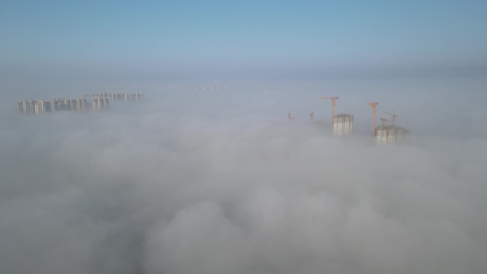 城市建设建筑工地阳光塔吊航拍穿云4K素材