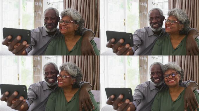 一对高级非裔美国夫妇在自拍。隔离期间的社交距离